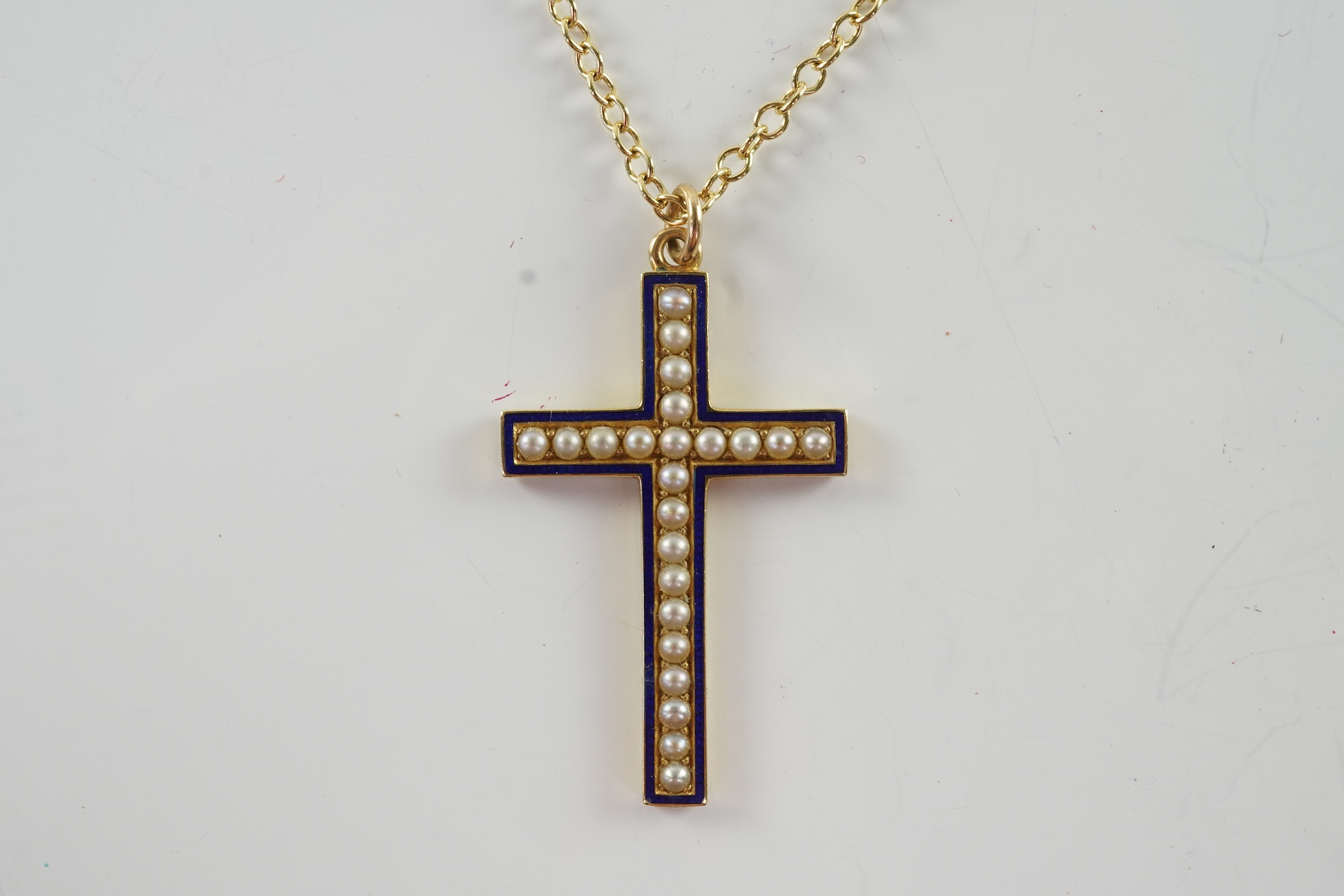 An Edwardian pearl and enamel cross and chain, early 20th century